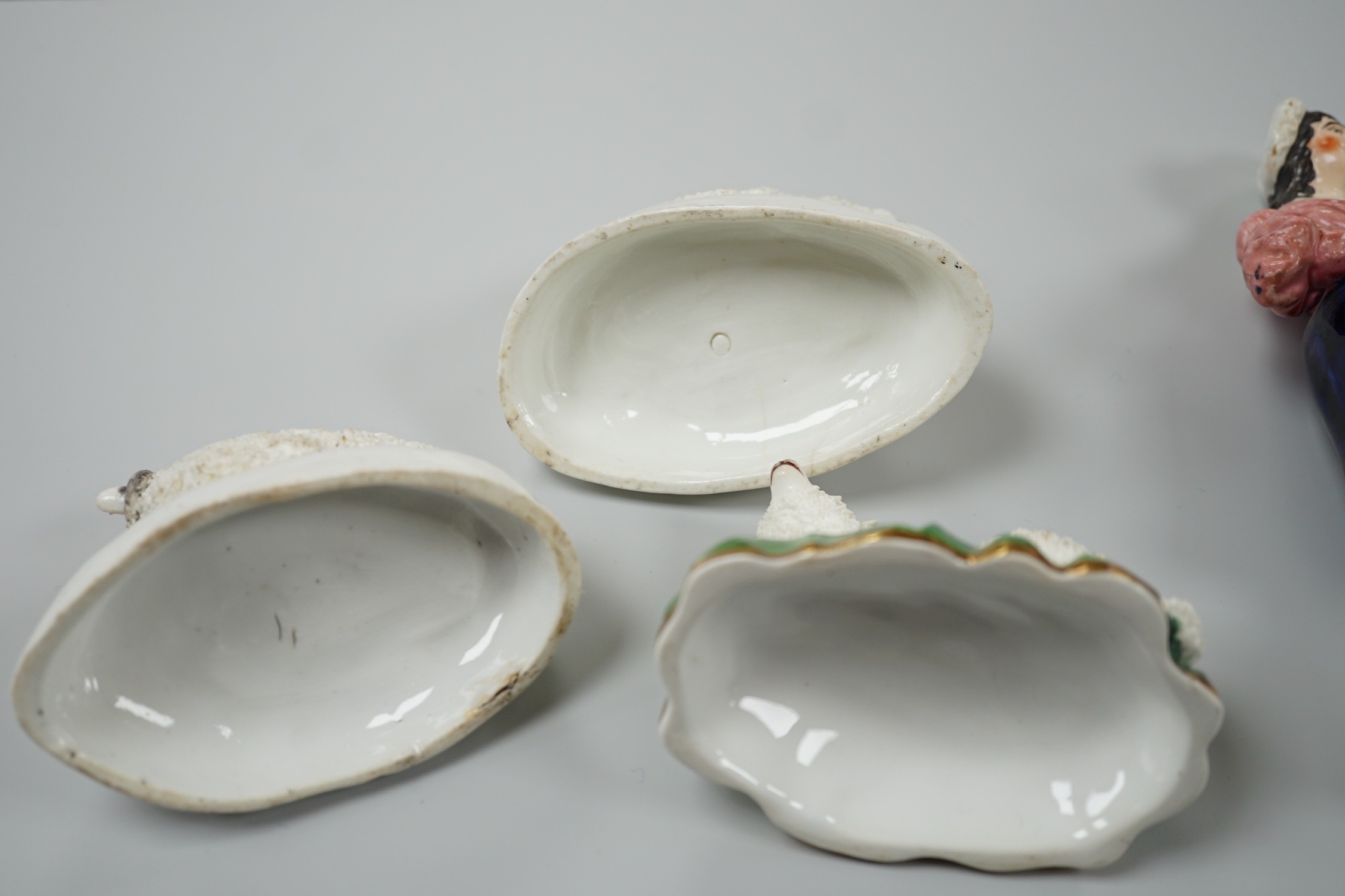 Three small Staffordshire models of recumbent sheep on oval mounted bases, together with a Staffordshire model group of a shepherdess, c.1830-50, (4). Tallest 17.5cm, Provence: Dennis G.Rice collection